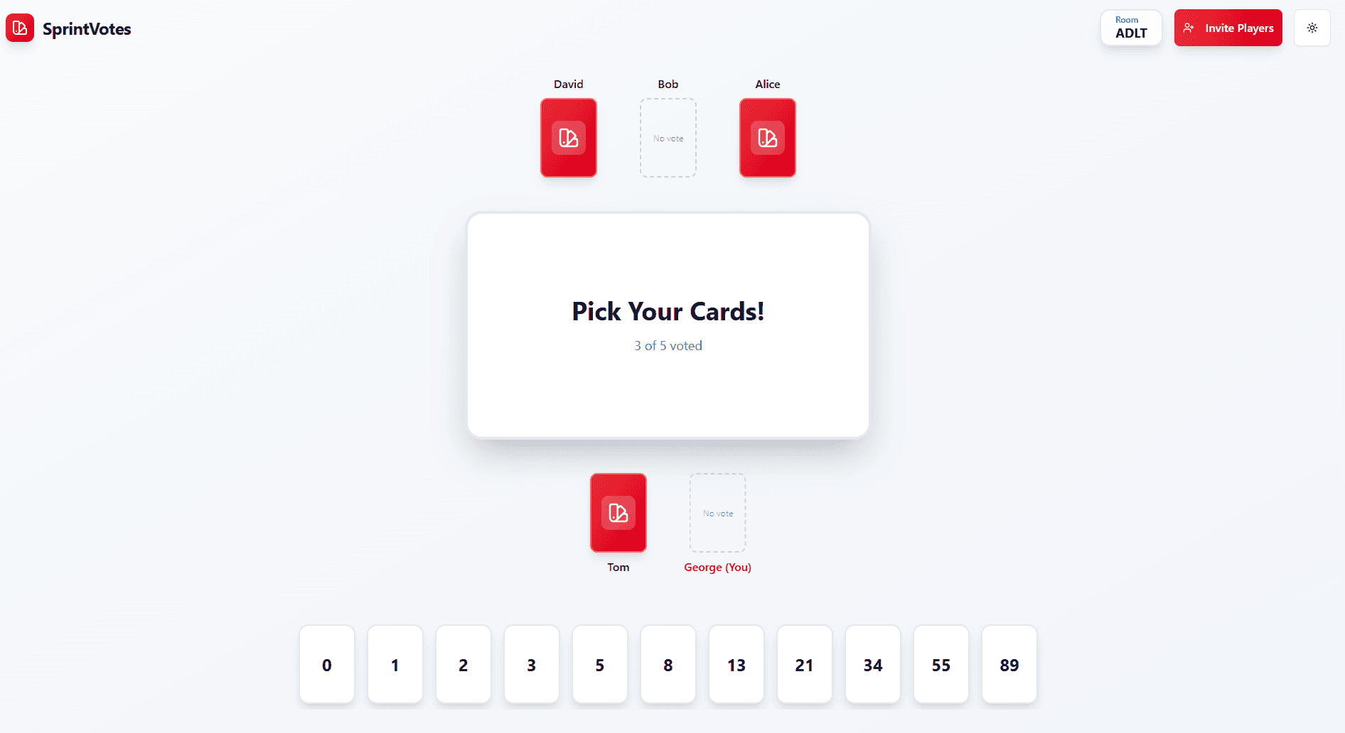 Team members voting on story points with hidden cards